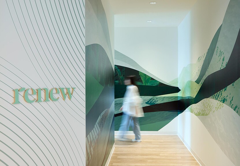 A person walking down a hallway.