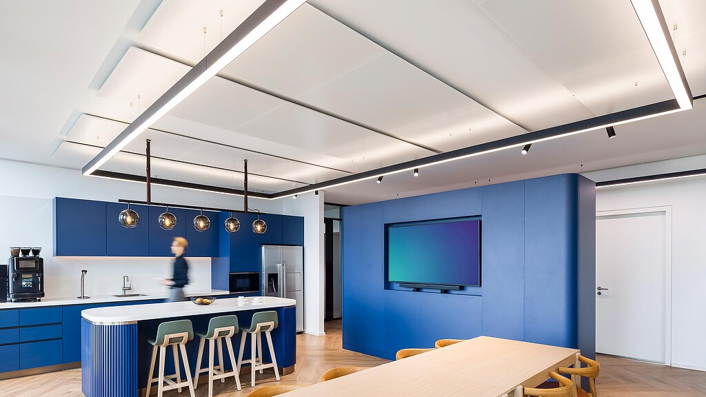 A room with blue walls and a table and chairs.
