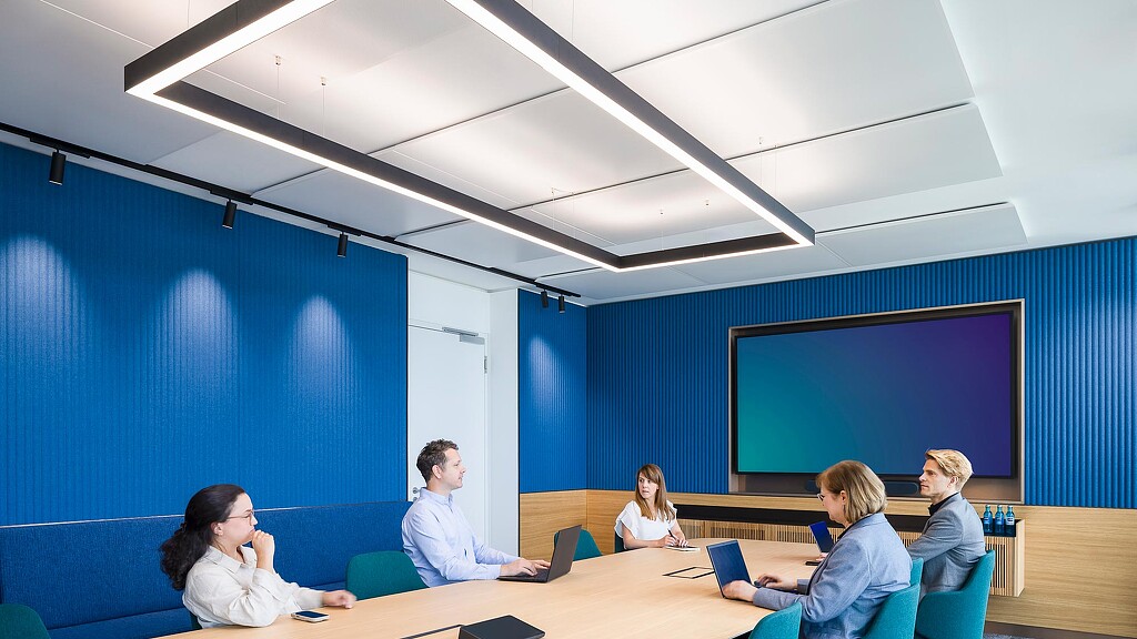 A group of people sitting around a table.