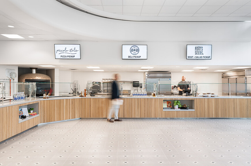 A person standing in a large room.