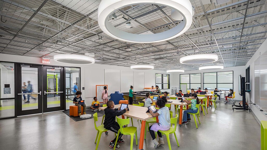 A group of people sitting around a table.