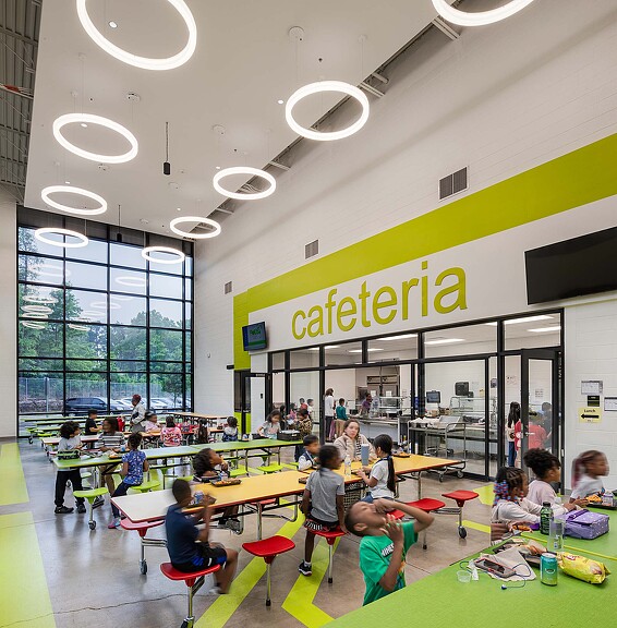 A group of people sitting at tables.