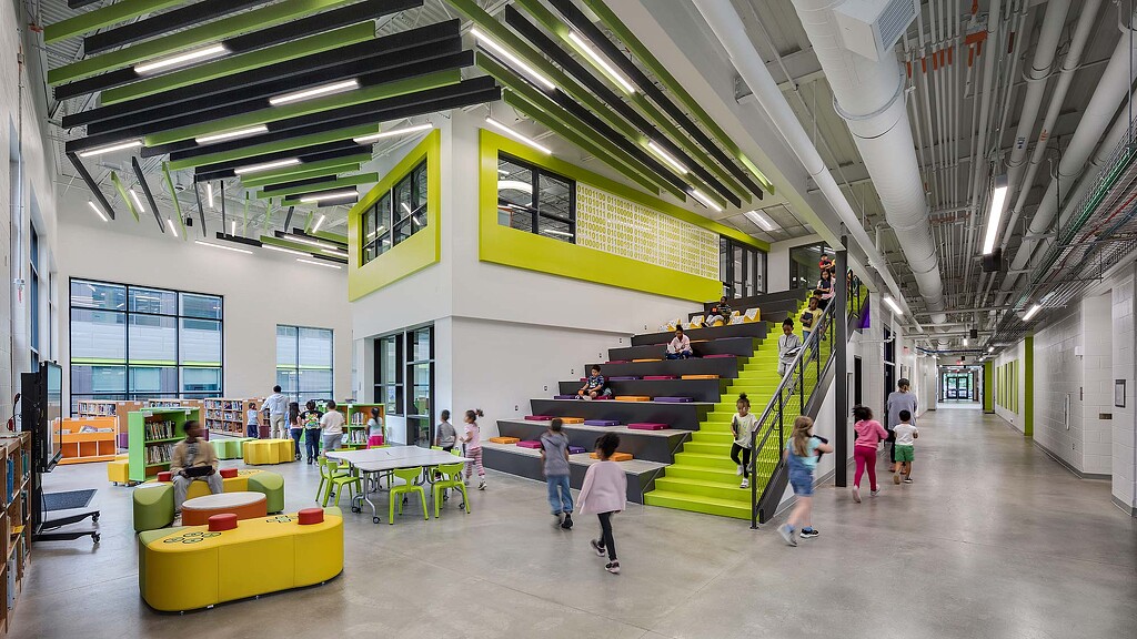 A group of people walking inside a building.