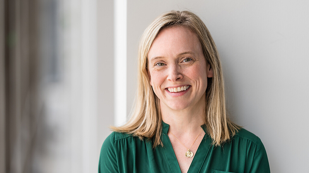A woman smiling for the camera.