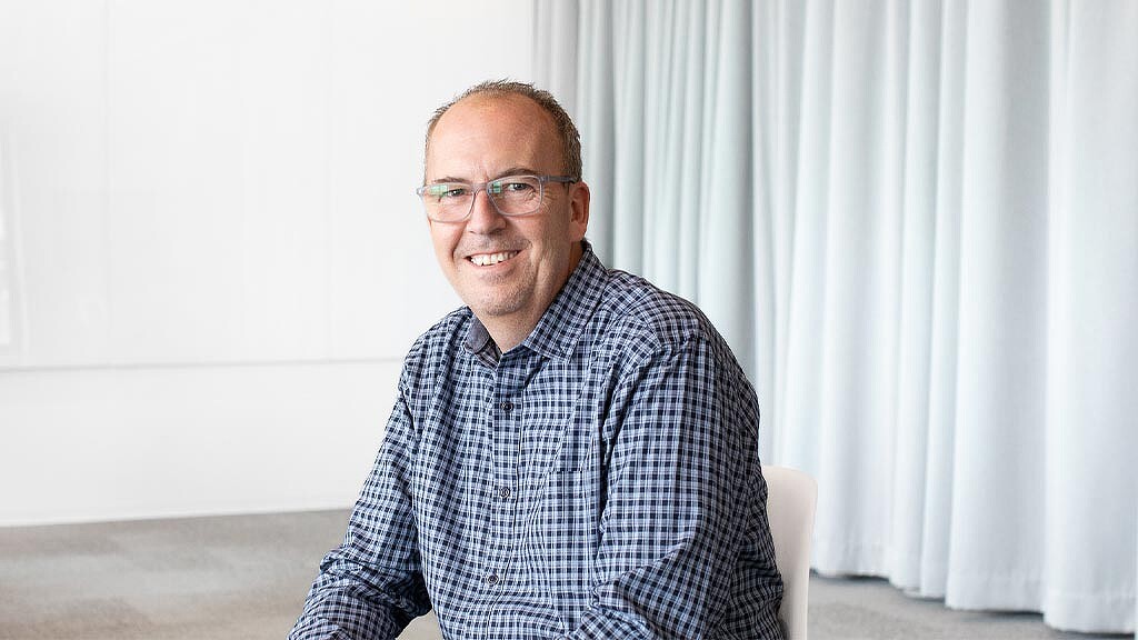 A man sitting in a chair.