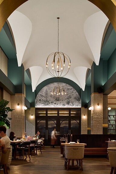 A large room with tables and chairs.