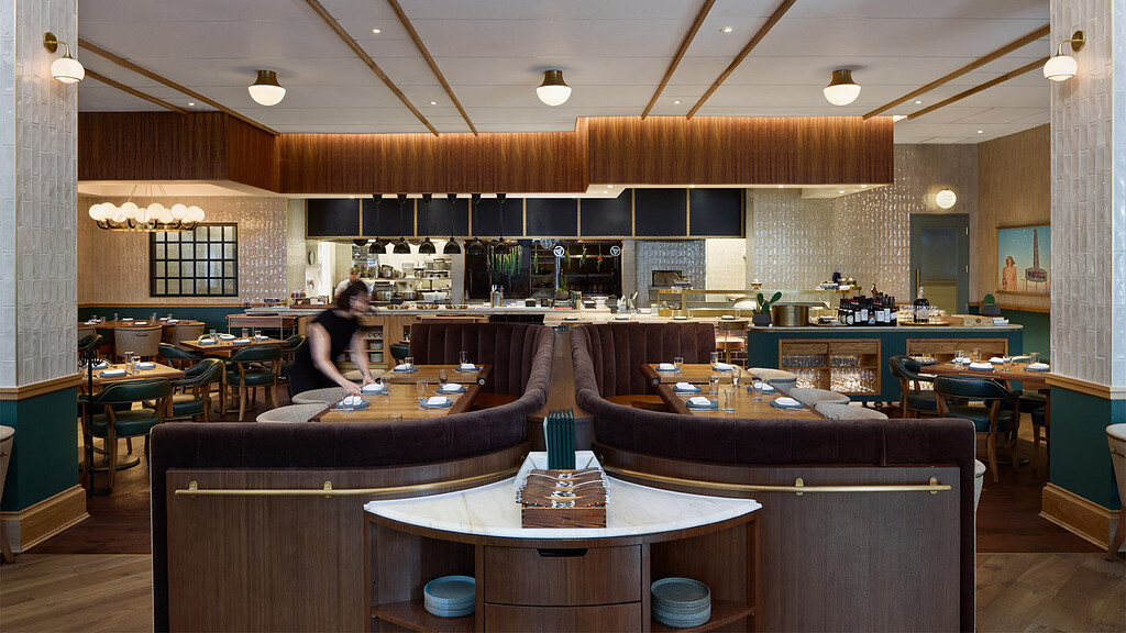 A large room with tables and chairs.