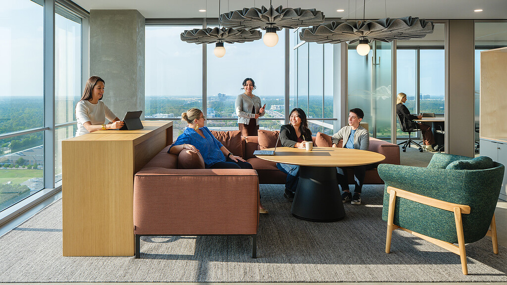 A group of people sitting around a table.