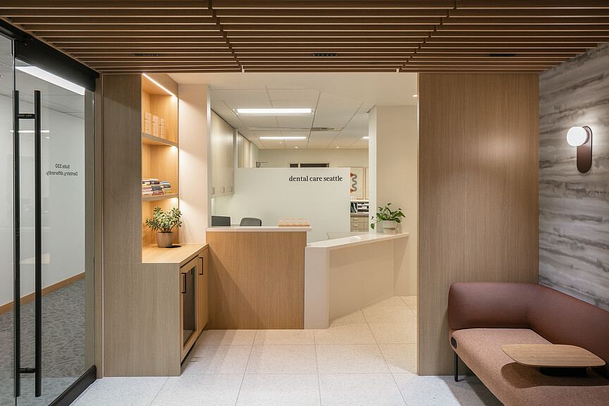 A room with a couch and a table.
