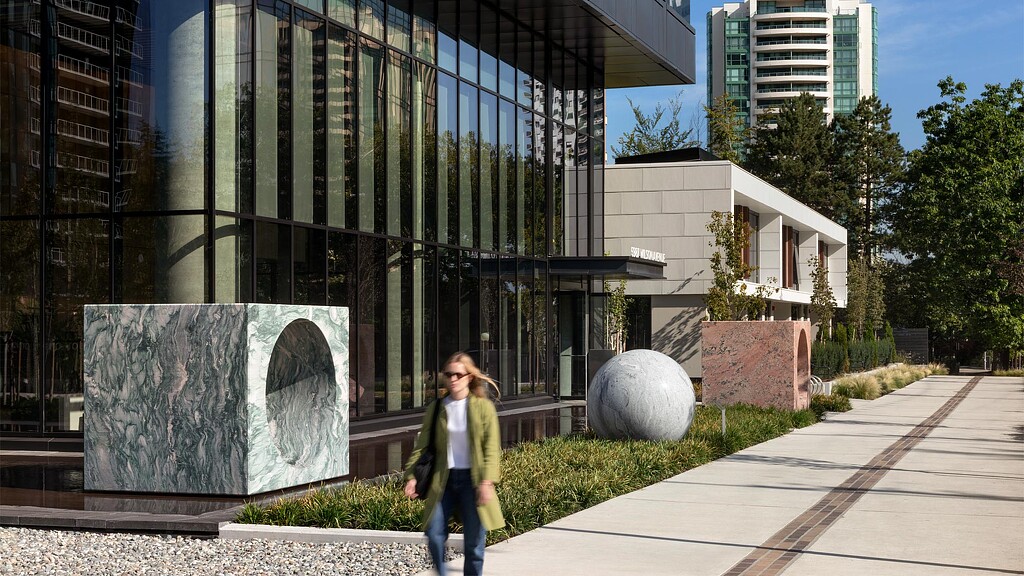 A person walking on a sidewalk.