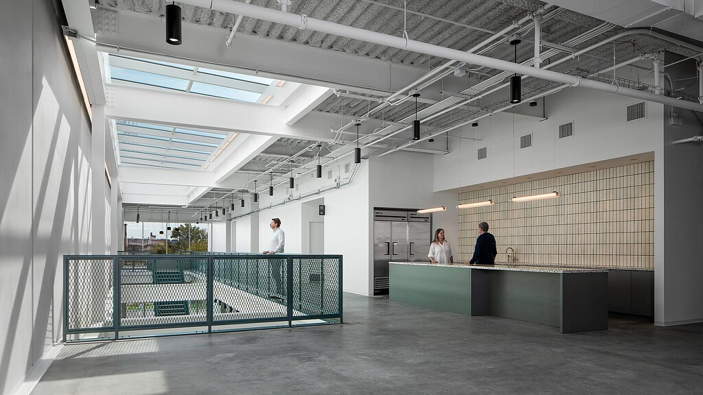 A few people in a building.