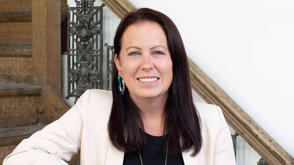 A woman smiling for the camera.