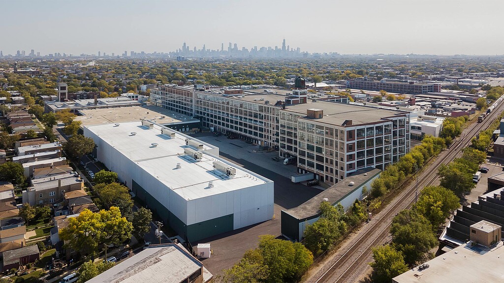 A large building with a parking lot.