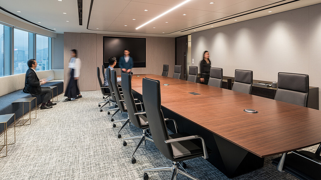 A group of people in a conference room.