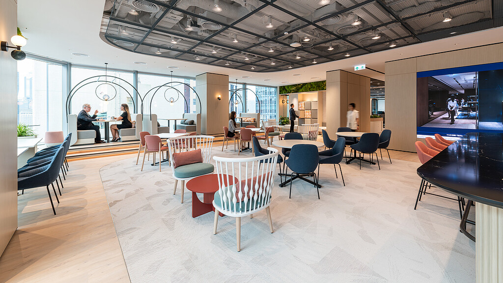 A room with tables and chairs.