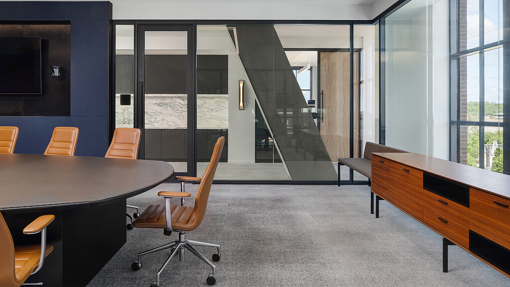 A room with a table and chairs.