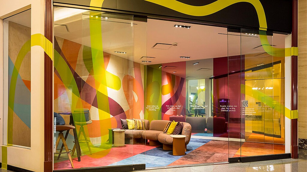 A room with a couch and a table.