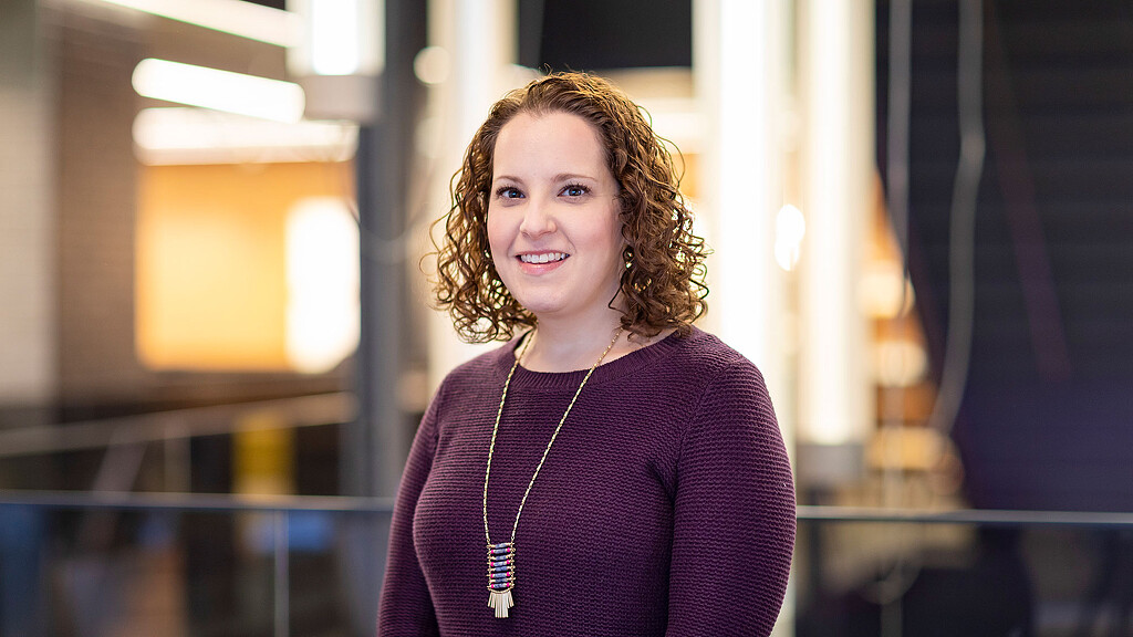 A person in a purple shirt.