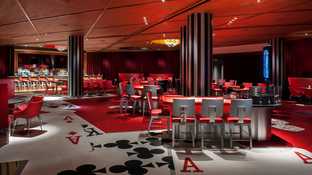 A room with red chairs and tables.