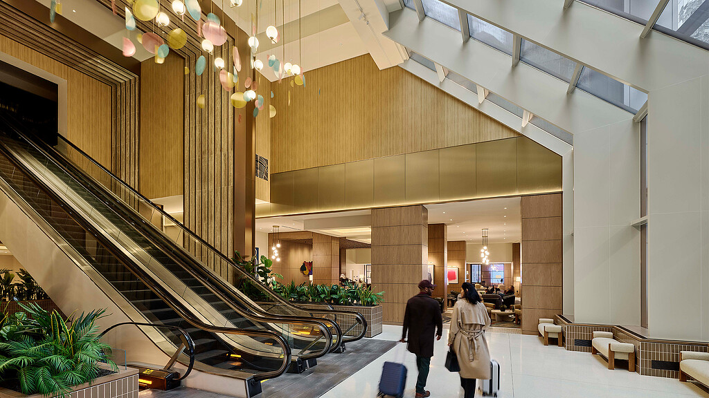 A couple walking down a flight of stairs.
