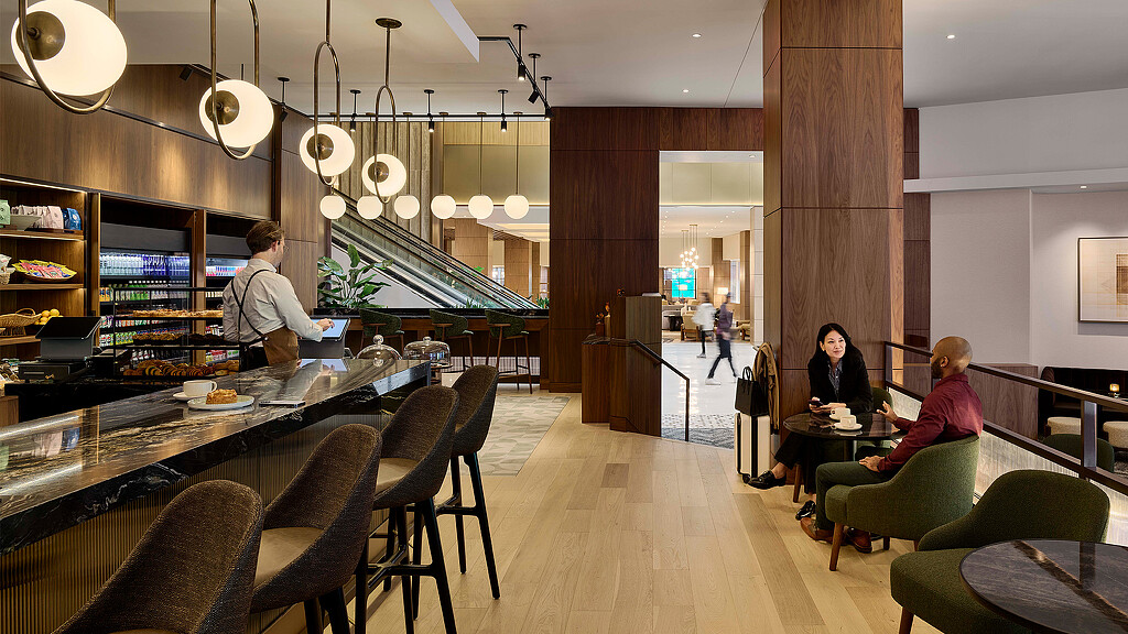 A group of people sitting at a table in a restaurant.