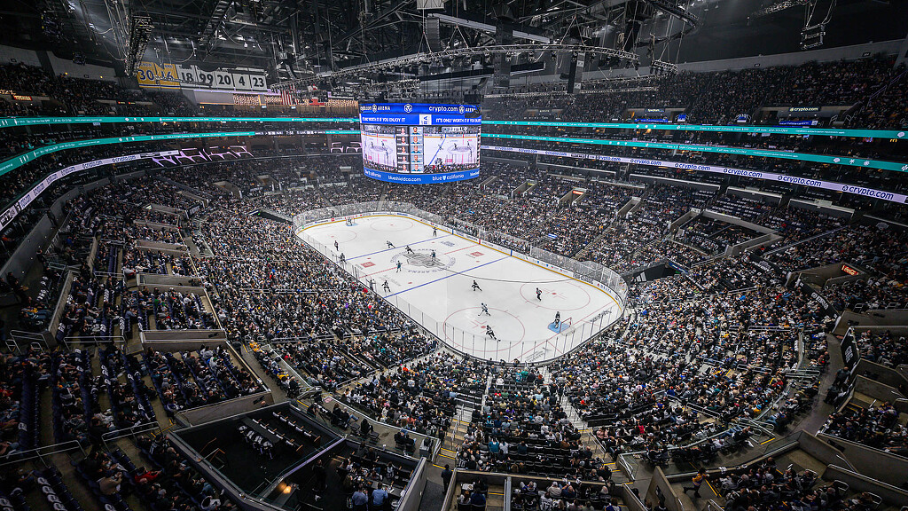 A large arena with a large crowd.