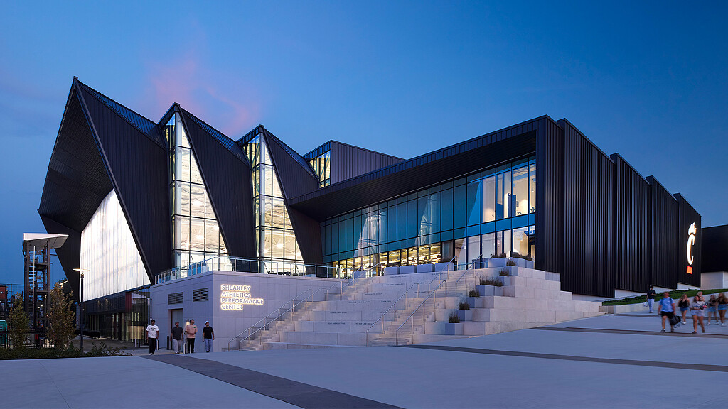 A building with stairs and people outside.