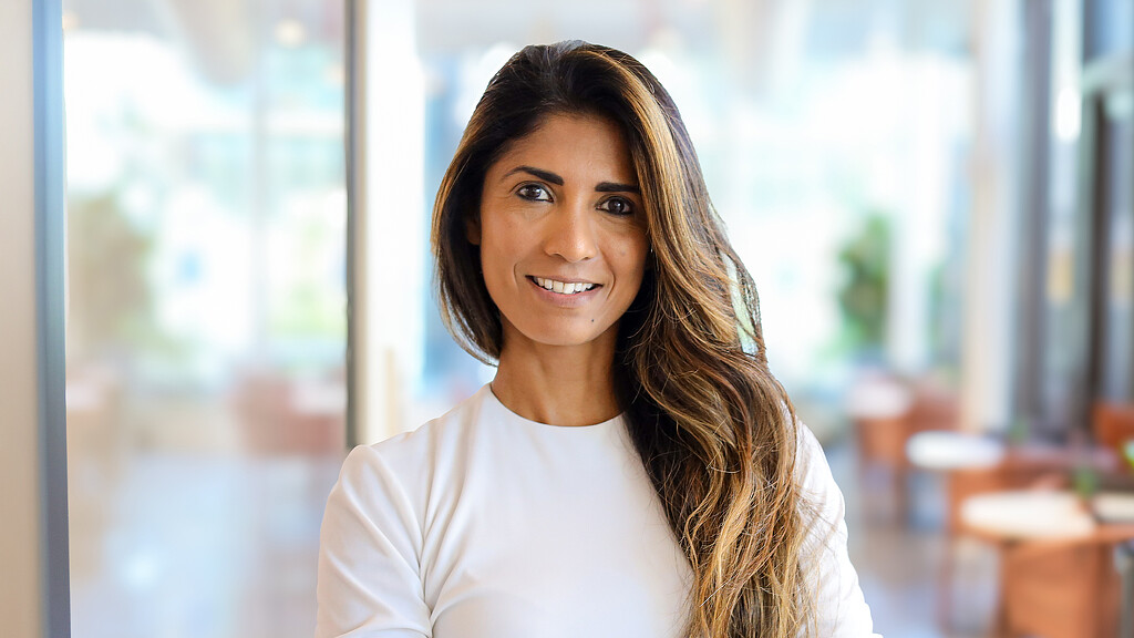 A woman smiling at the camera.