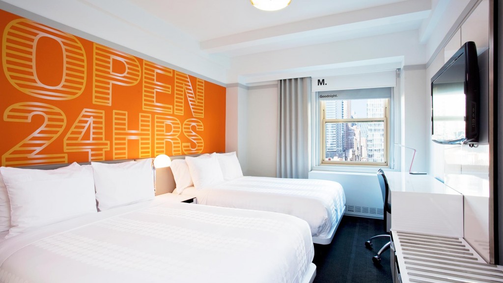 A hotel room with two beds.