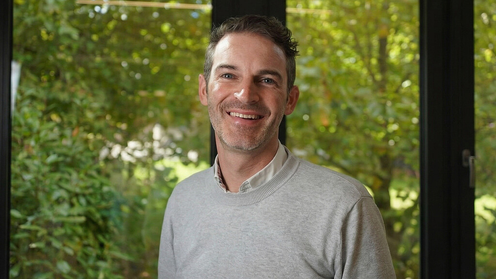 A man smiling for the camera.