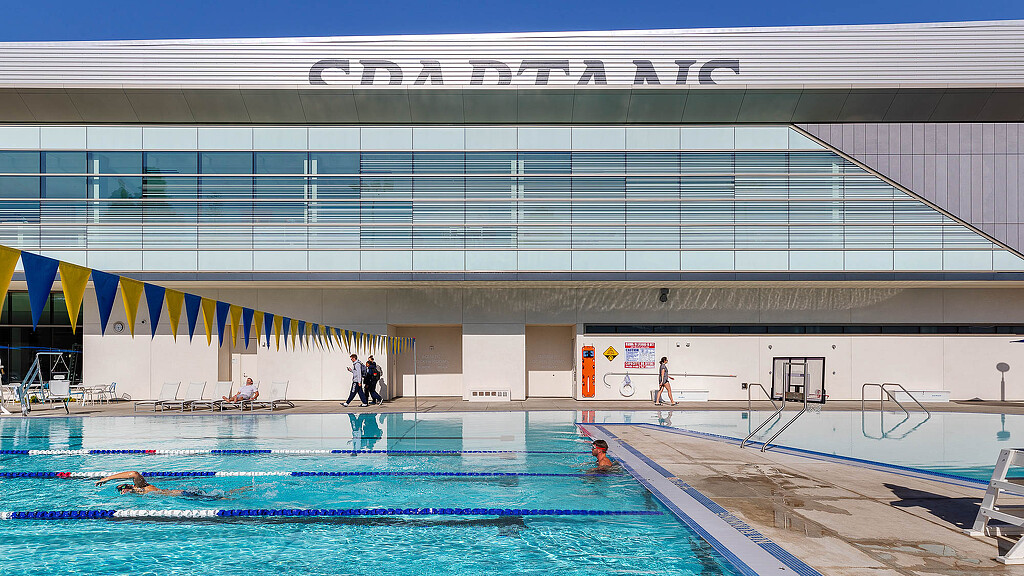 A swimming pool with people in it.