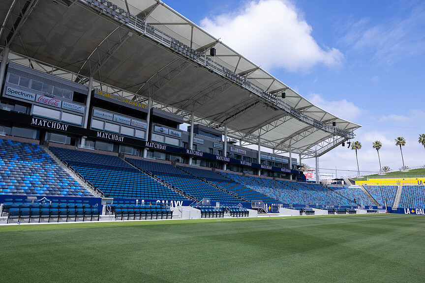 A sports stadium with a field.