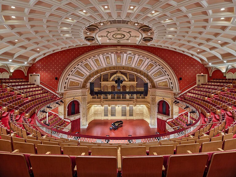 A large theater with rows of seats.