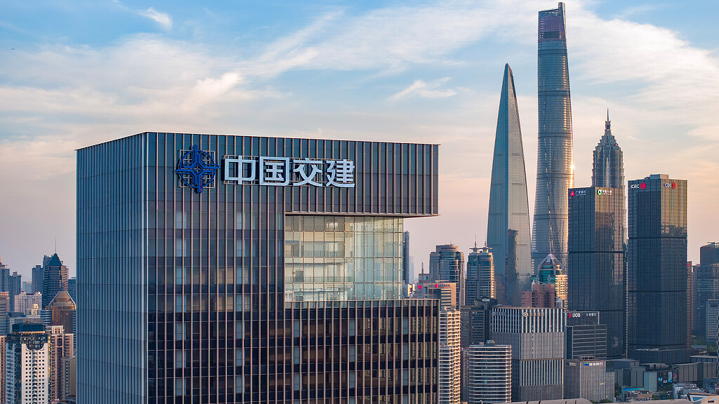 A city skyline with a sign.
