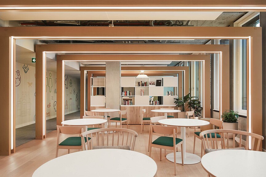 A room with tables and chairs.