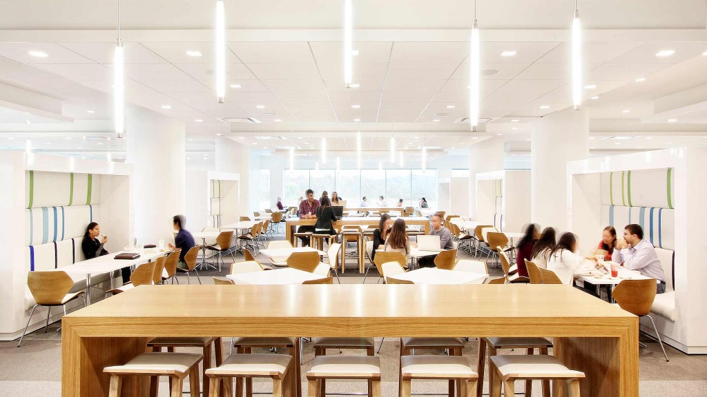 A group of people sitting at tables.