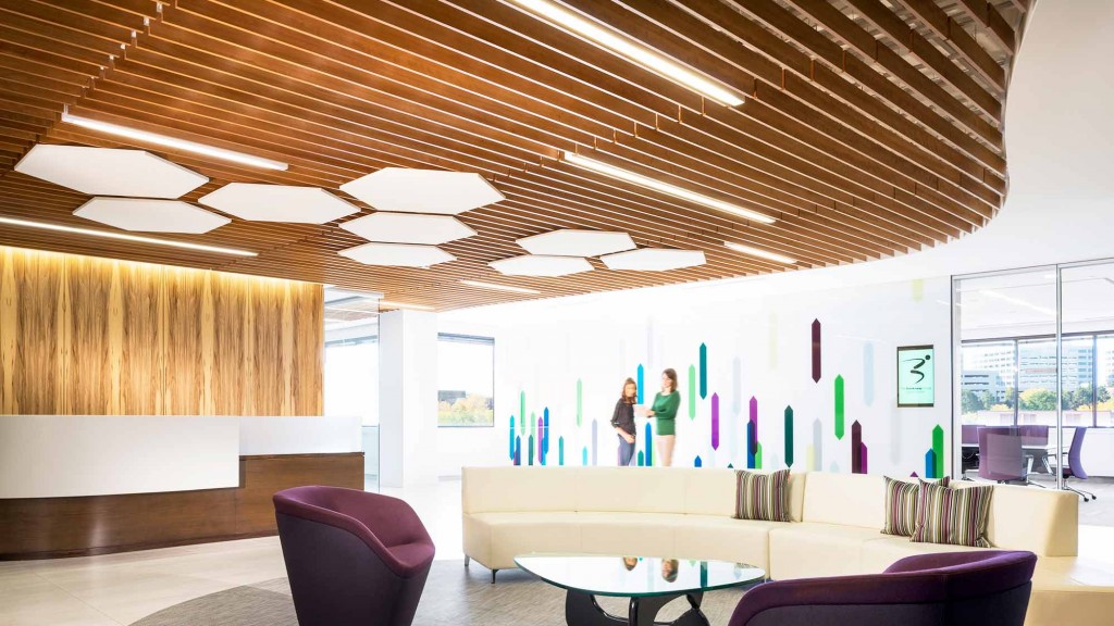 A room with a table chairs and a couple of people in it.