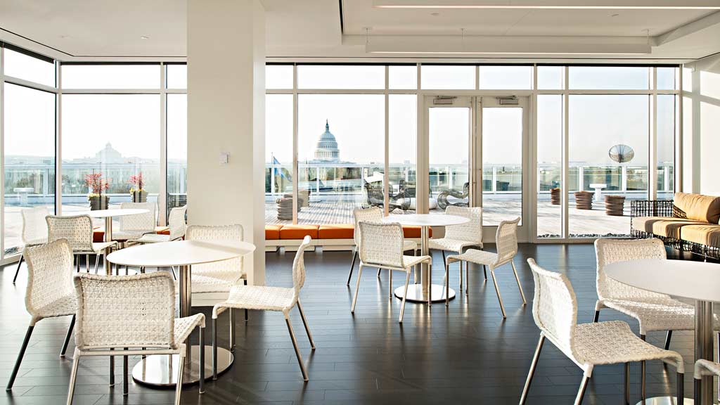 A room with tables and chairs.