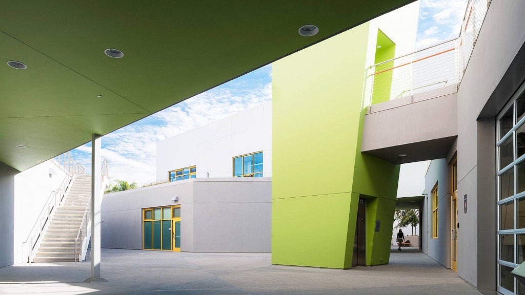 A long hallway with yellow doors.