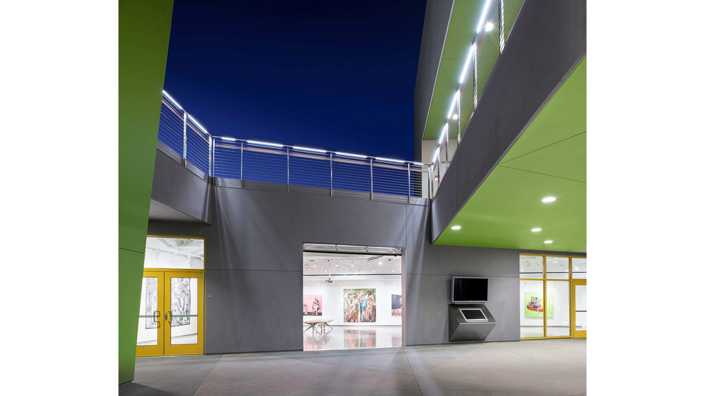 A building with a blue railing.