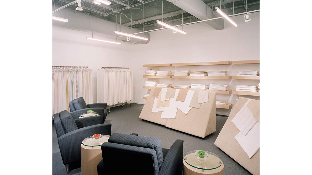 A room with a table chairs and a couch.