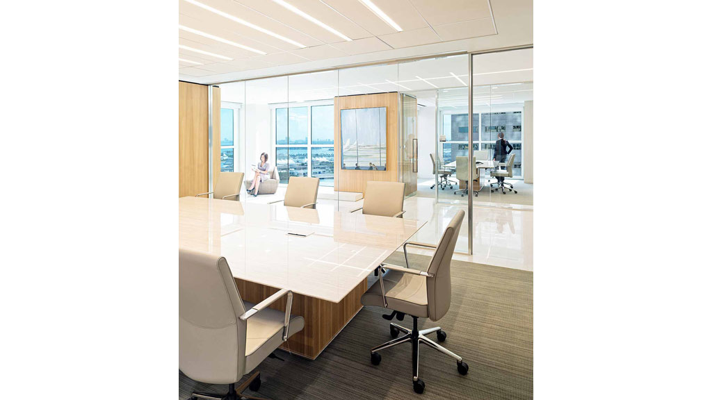 A room with a table and chairs.