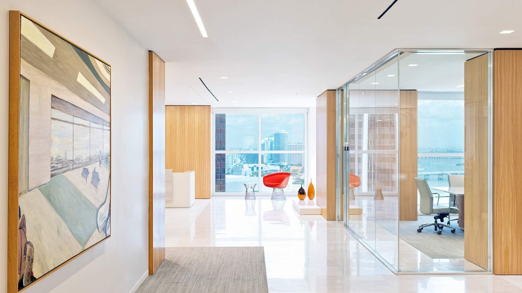 A room with a glass door and a large window.