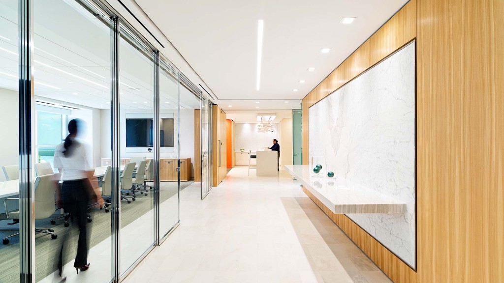 A person standing in a hallway.