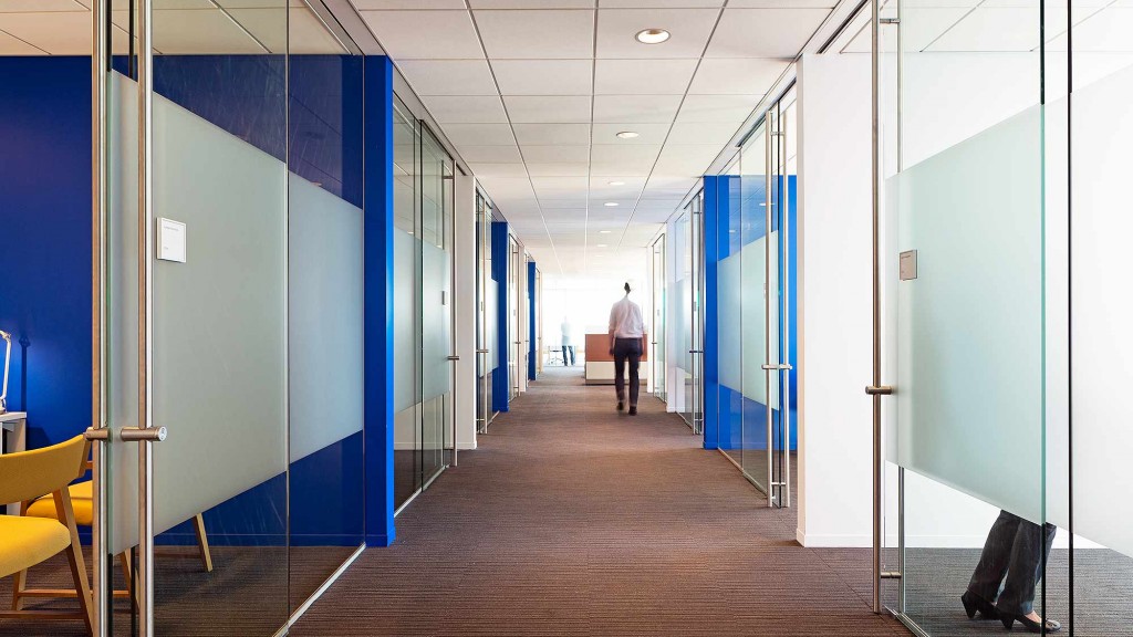 A person walking in a hallway.