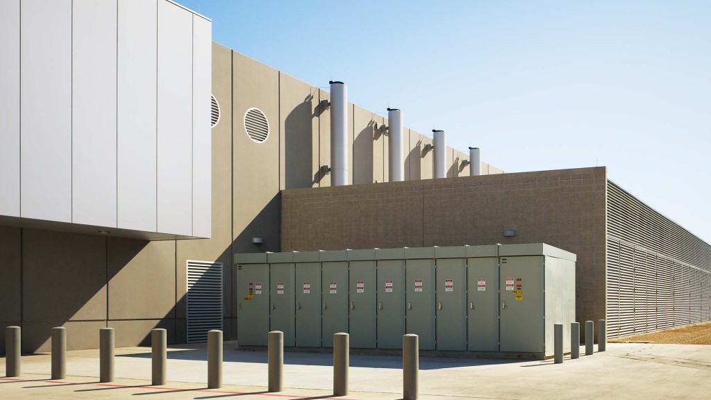 A building with a few containers.