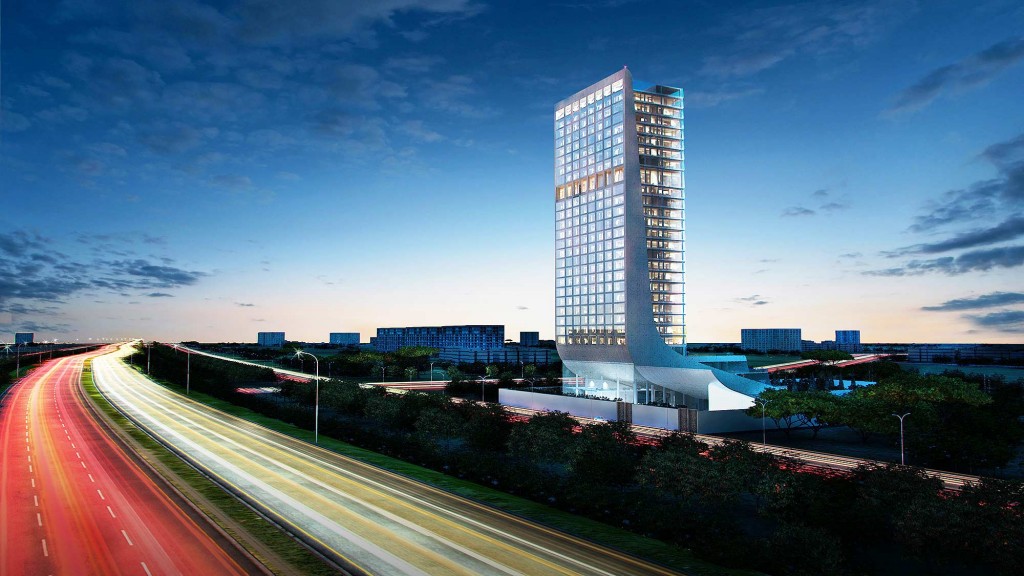 A road leading to a tall building.