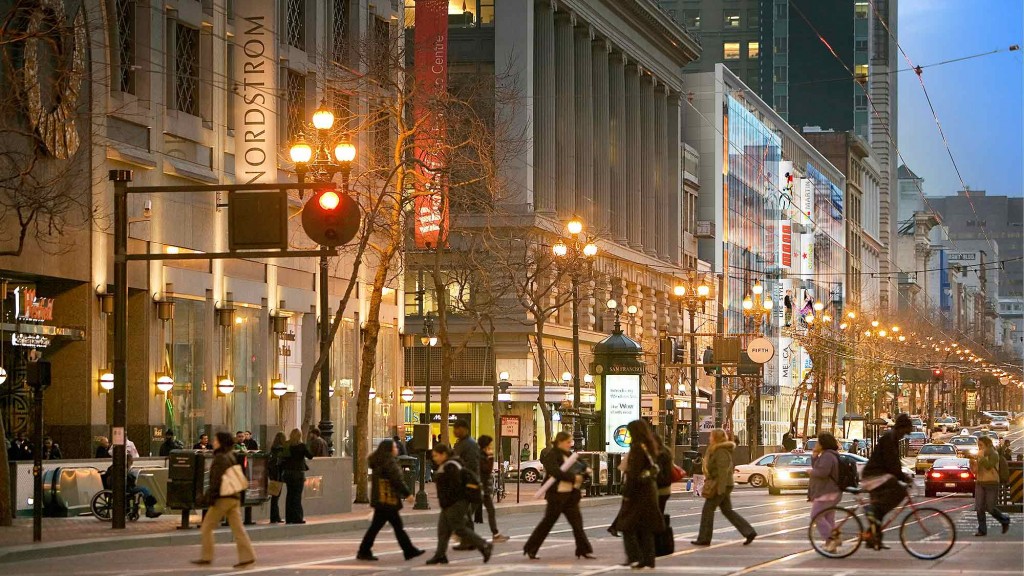 People crossing a street in a city.