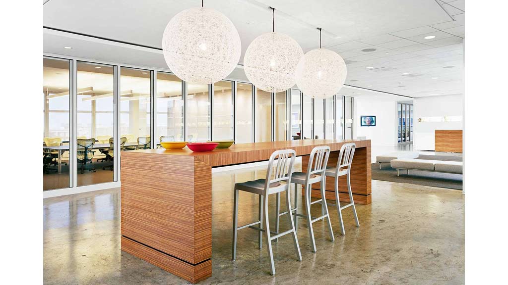 A large room with a table and chairs.