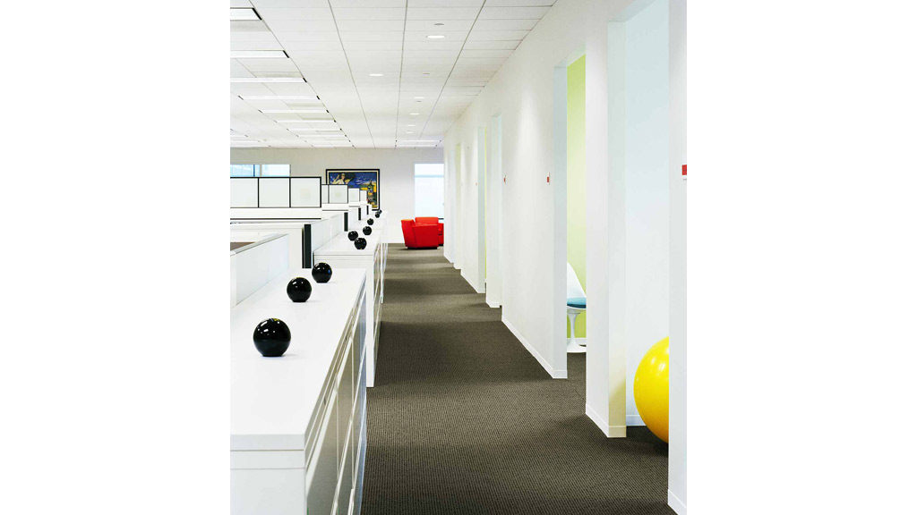 A hallway with exercise equipment.